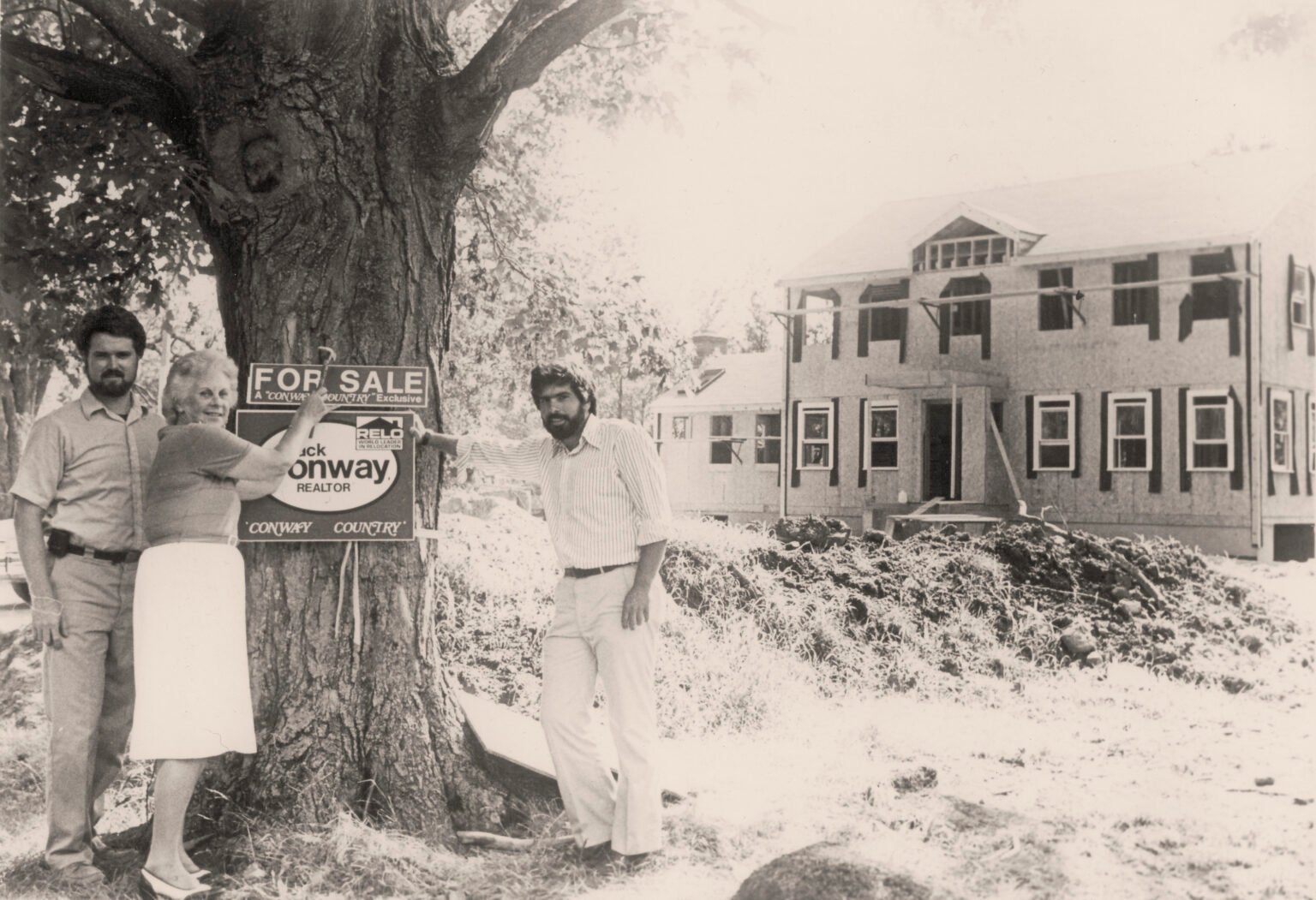 Lloyd Geisinger and Betty Fegan with David Mayfield at Thorndike Development's first home sale, early 1980s