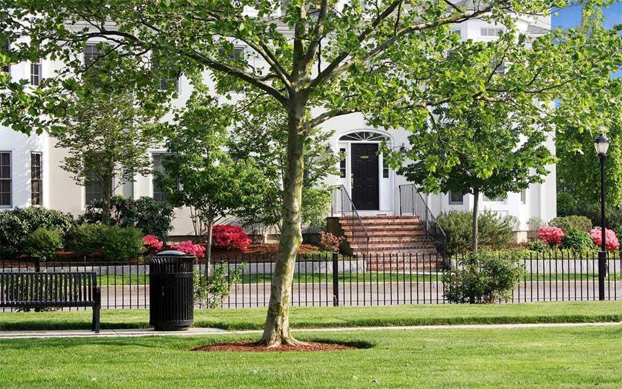 Award-winning Chapman's Reach condominiums at Marina Bay in Quincy MA, with classic brick entry steps and blooming azaleas
