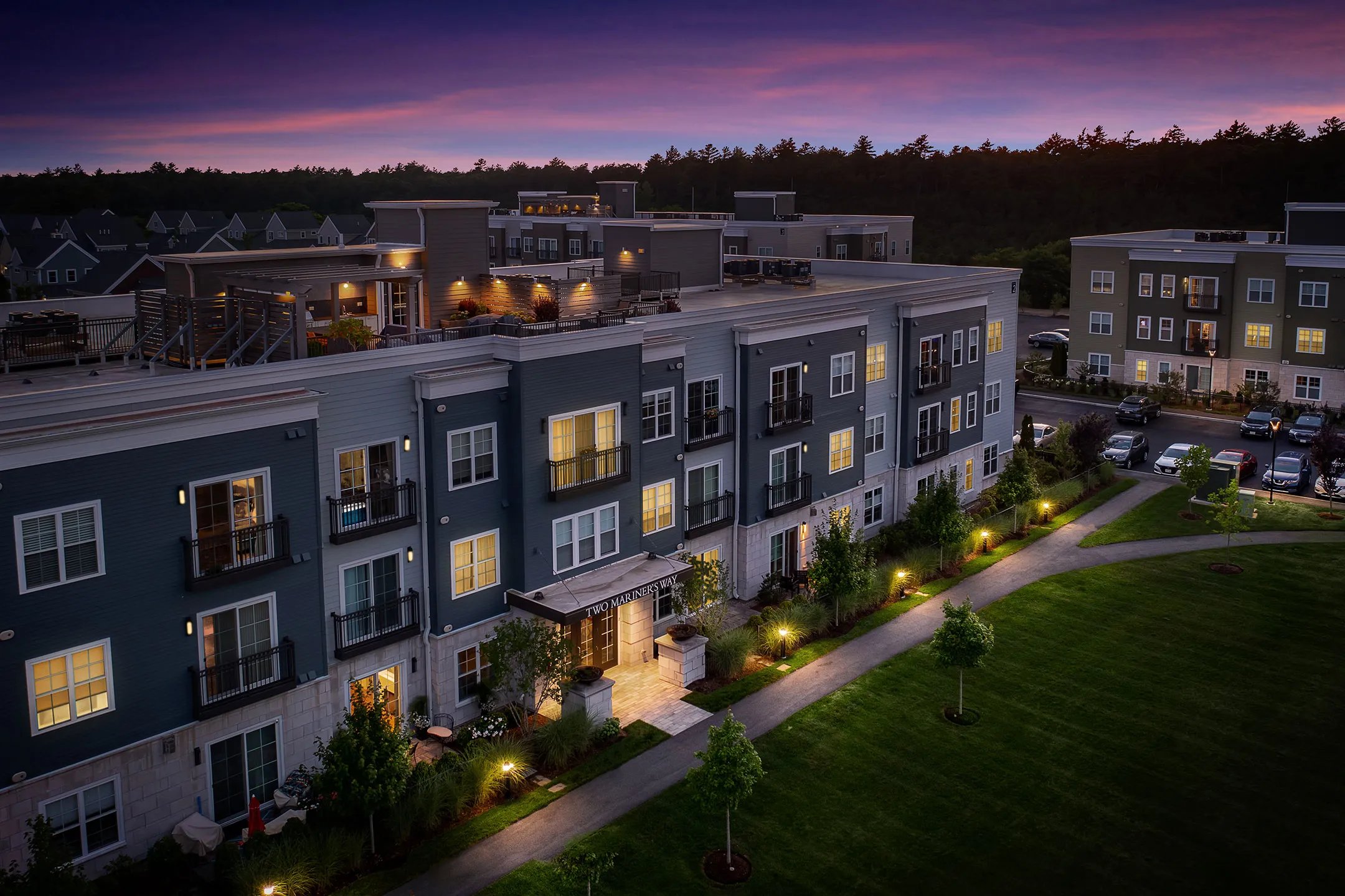 Sawyer's Reach condo buildings at twilight in Plymouth MA active adult community