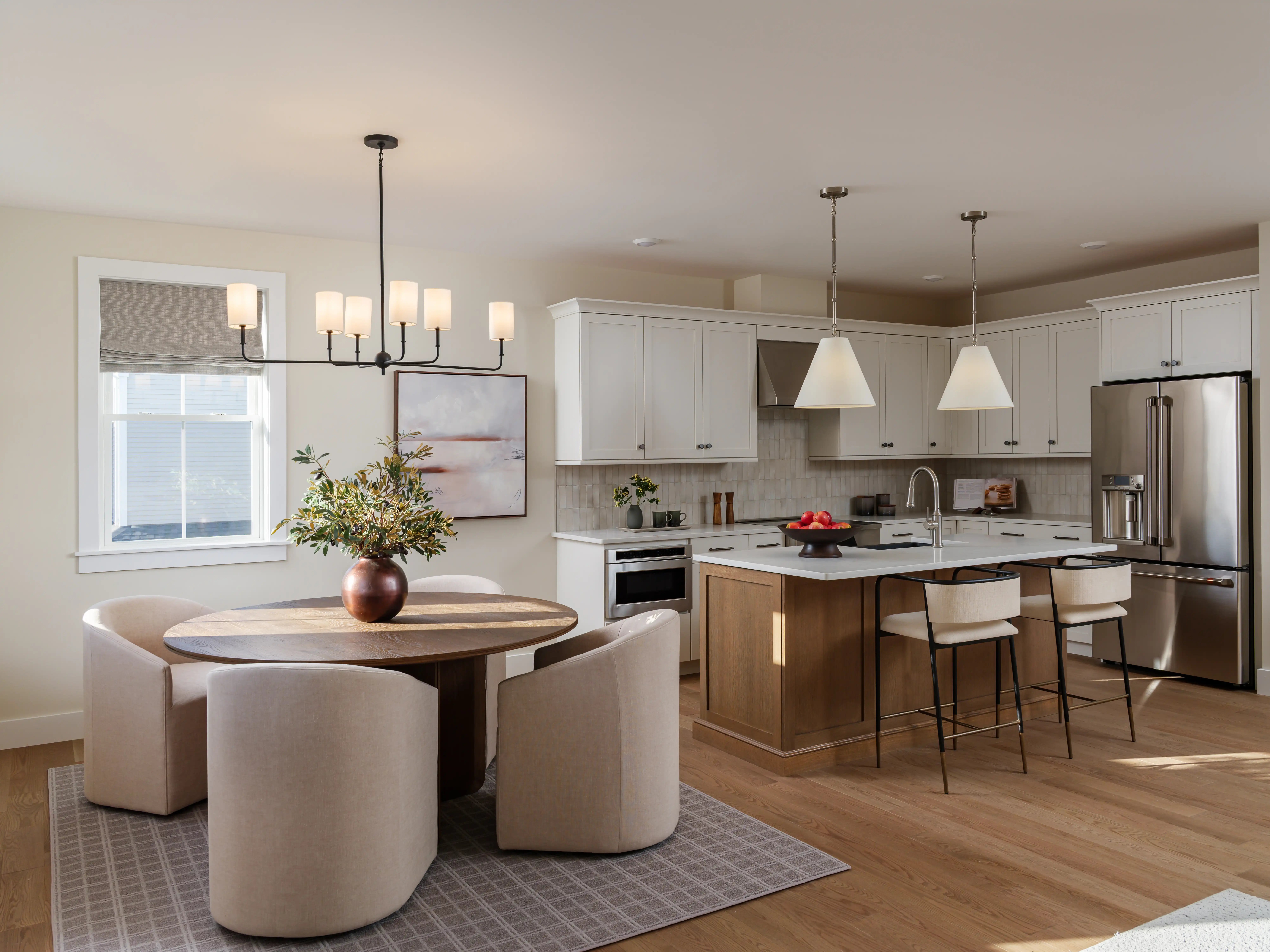 New homes in Massachusetts with landscaped streetscape and community pool